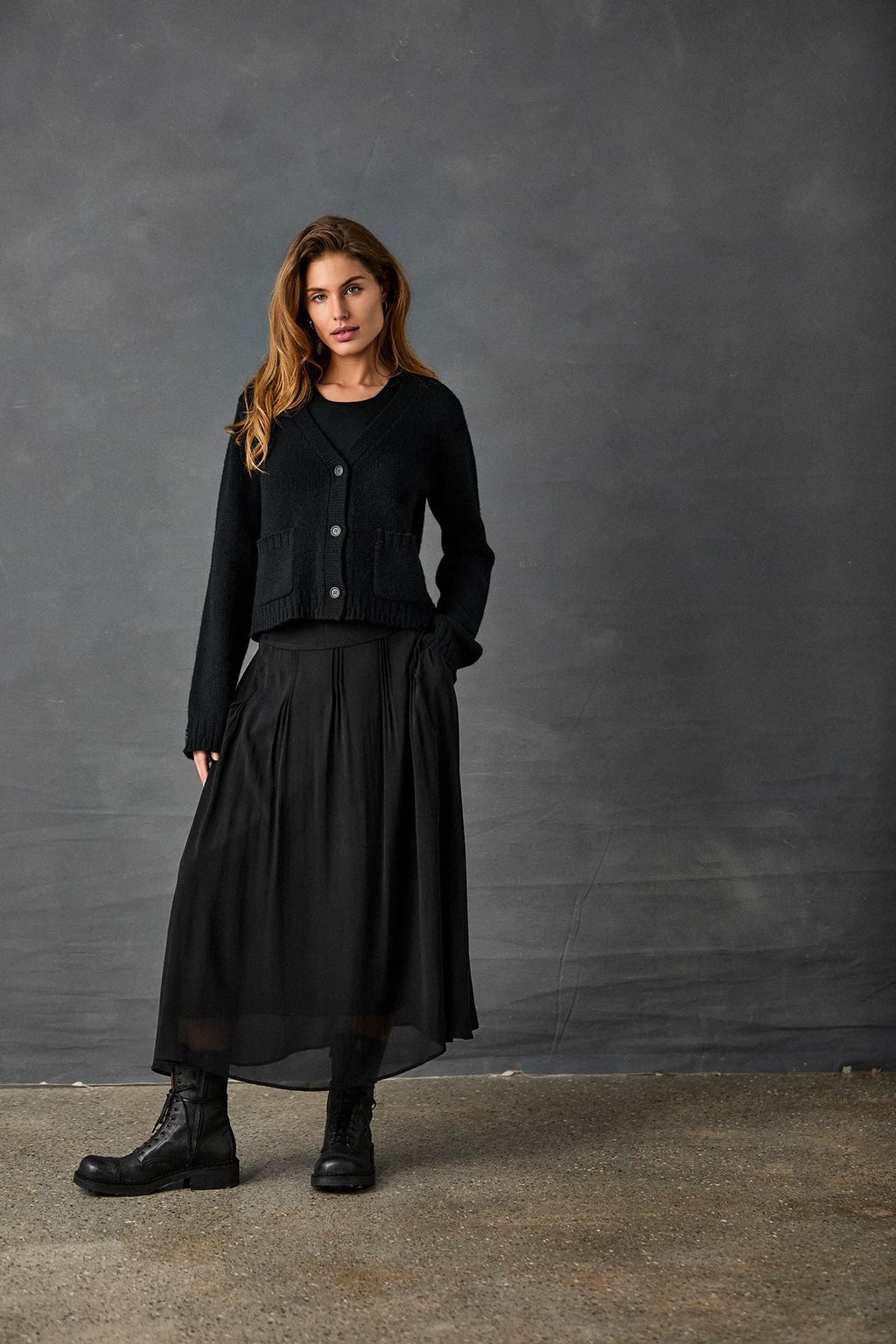Black Pleated Skirt with Knitted Cardigan