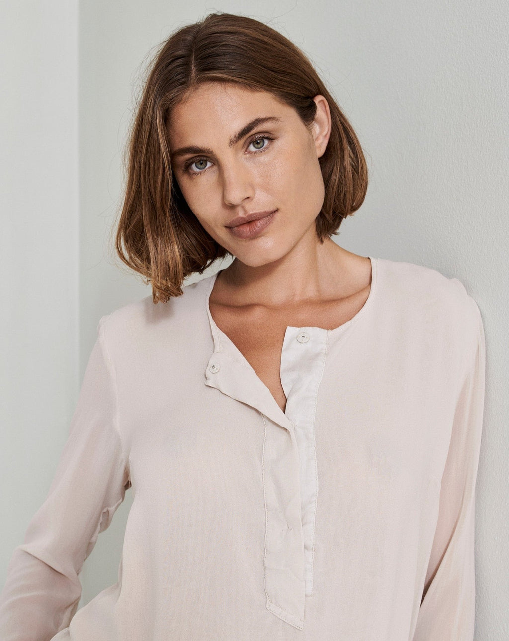 Light Pink Long Sleeved Button Decorated V-Neck Shirt